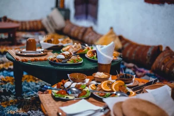 A spread of Moroccan dishes on the table