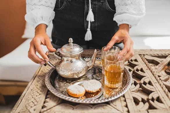 Mint tea being poured tableside
