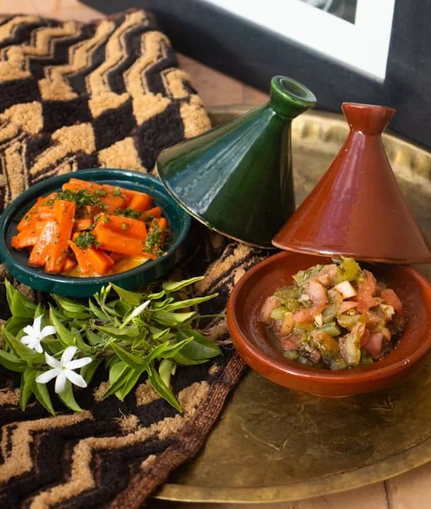 A traditional tajine set with fresh vegetables
