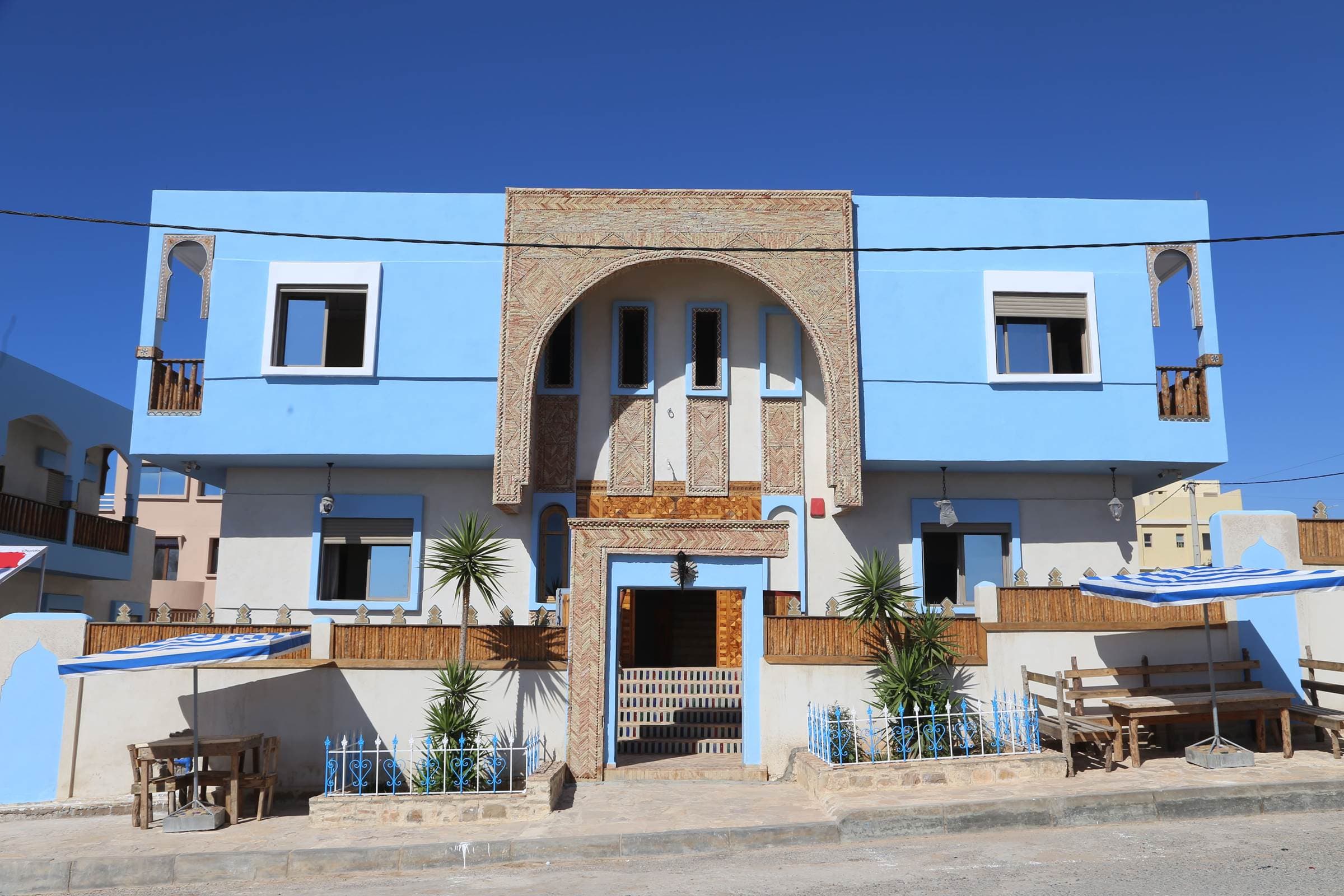 The blue and white facade of the riad