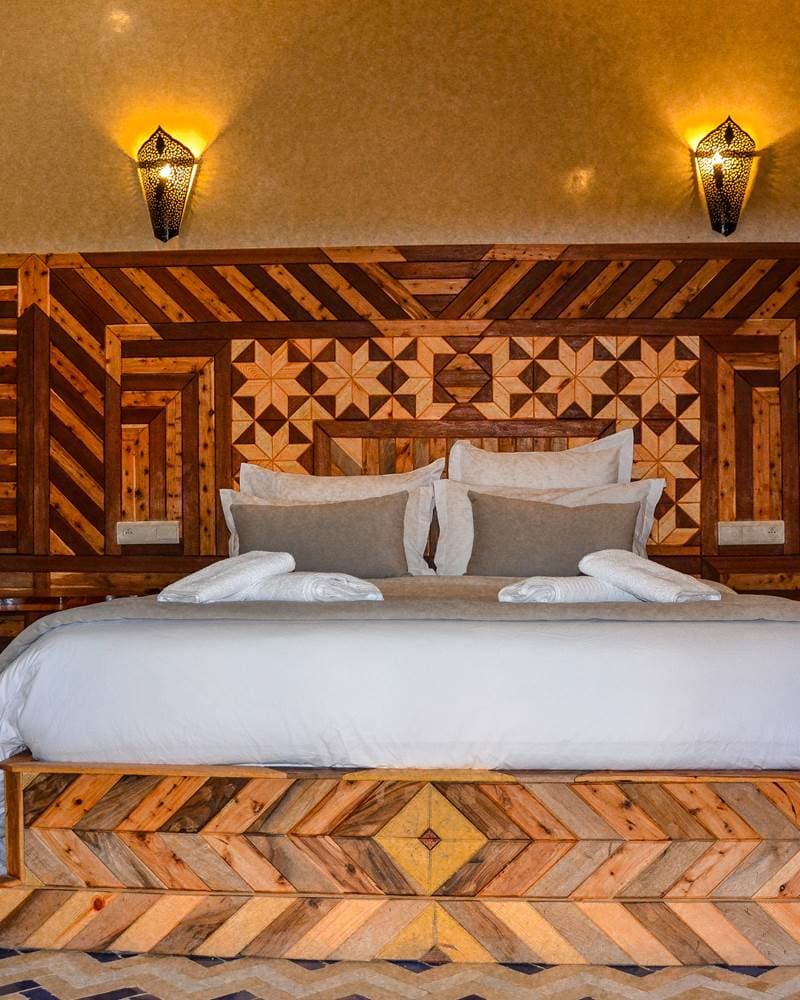 The Royal Suite, with a private Moroccan lounge and a balcony over the pool
