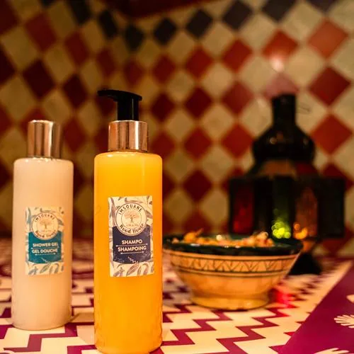 A massage room prepared with warm towels and low light
