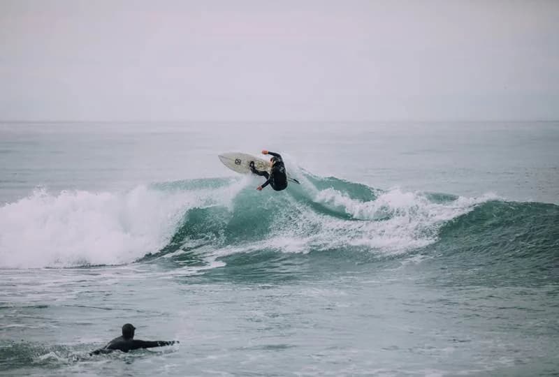 An experienced surfer deep in the pocket of a clean wave